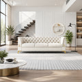 Velvet three-seater sofa