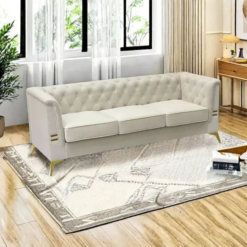Velvet three-seater sofa